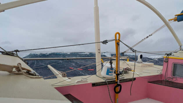 :arge waves behind a boat