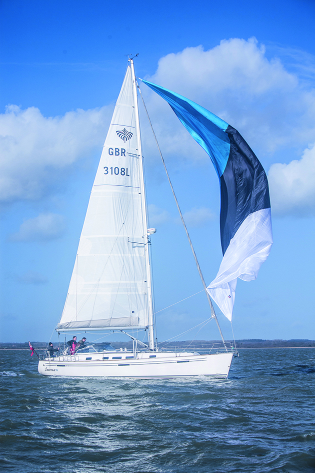 A yacht gybing with a cruising chute