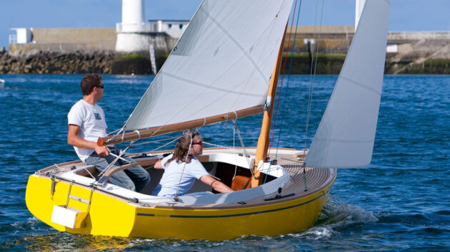 Two people sailing in a small boat
