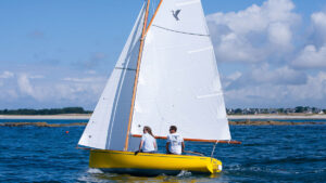 Two people sailing a Cormoran day saier