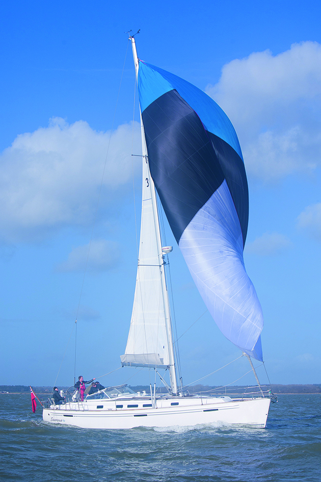 A yacht flying a cruising chute