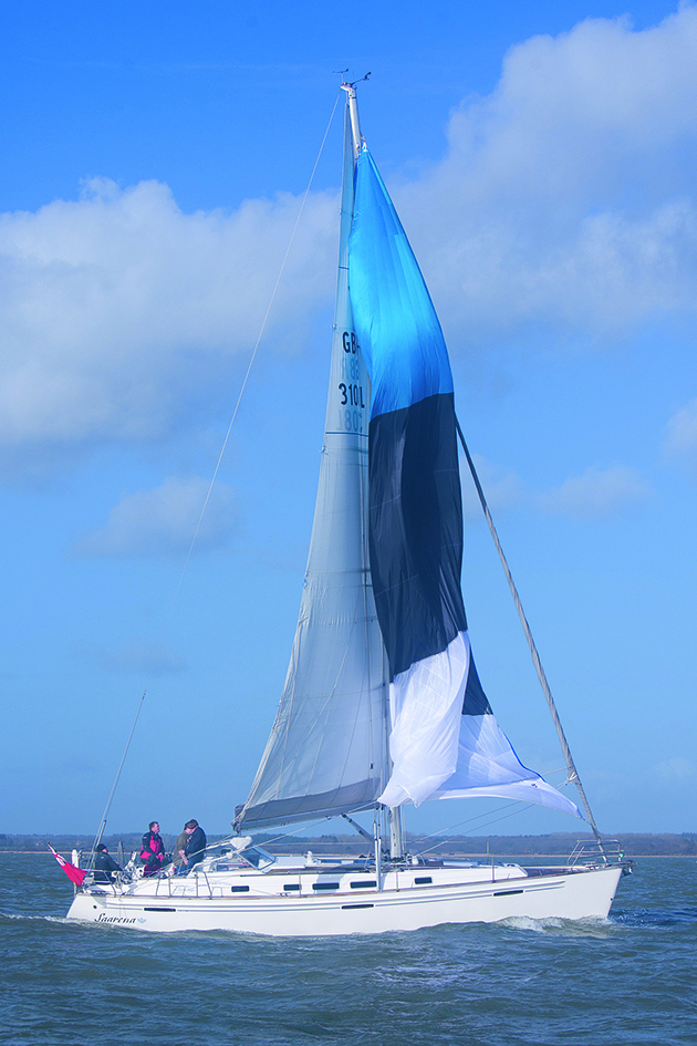 A yacht gybing with a cruising chute