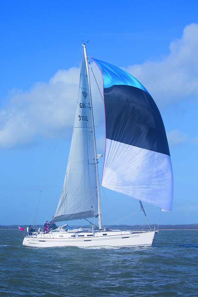 A yacht sailing with a cruising chute