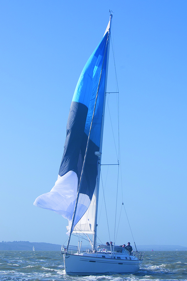 A yacht gybing with a cruising chute