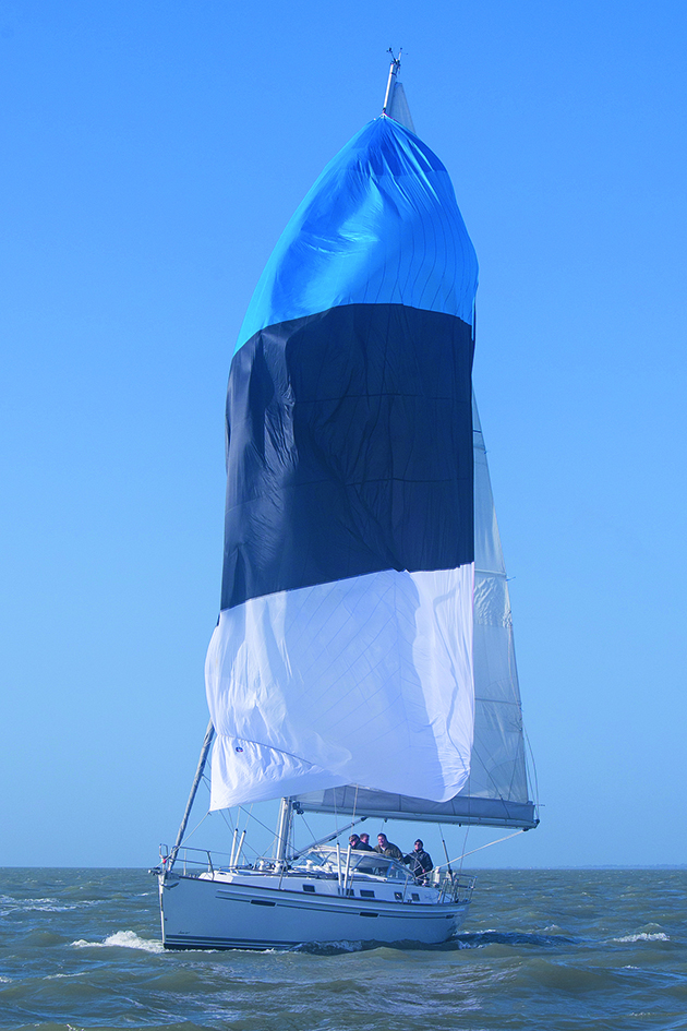 A yacht flying a cruising chute