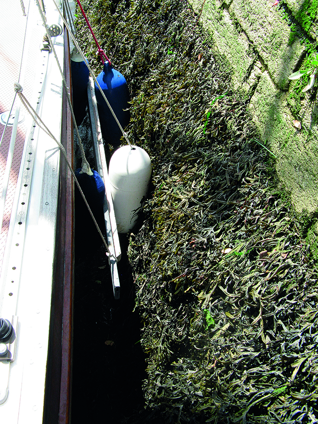 a man using a fenderboard on a yacht