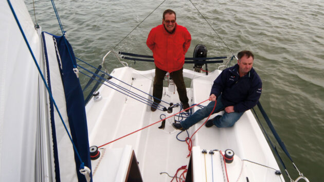 Two men sailing a Storm 22 yacht