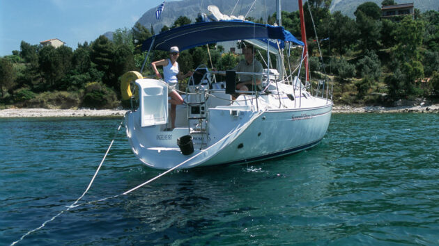 A yacht moored with anchors