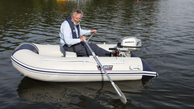 Emrhys Barrell rowing a tender dinghy