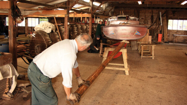 Men winterising a wooden boat