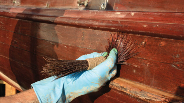 A man doing work on a boat
