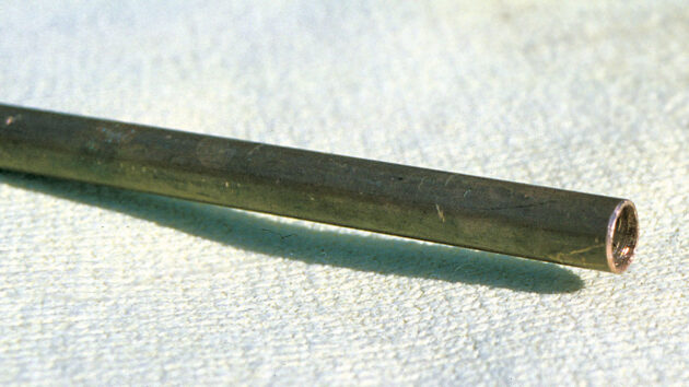 A piece of pipe being used for a compression joint