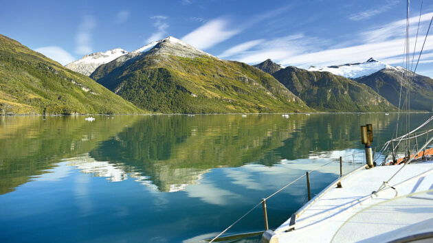 A yacht moored in a fjord in the Beagle Channel