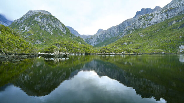 Two mountains by water