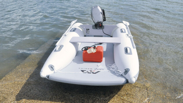 The Aircat 285 dinghy tender moored on a beach