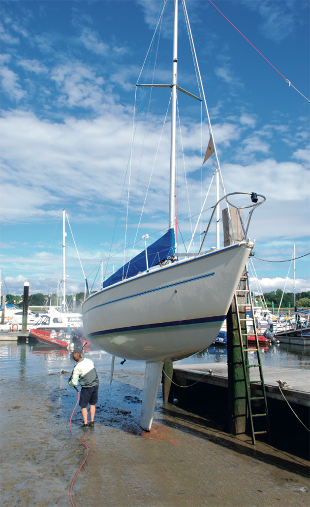 A man cleaning a boat