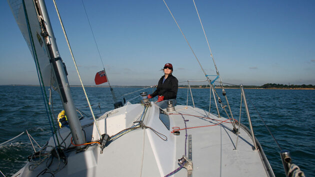  Woman at the helm of a yacht