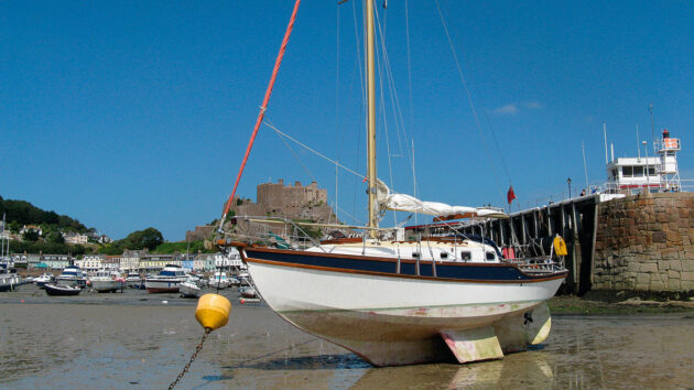 A yacht drying out on a beach