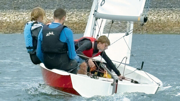 Family aboard Wayfarer Weekender dinghy with boy crewing. Credit: Dylan Wood