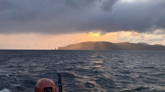 The sun sets behind MacLeod’s Maidens as Mike's Westerly Storm enters Loch Bracadale. Credit: Michael Skidmore