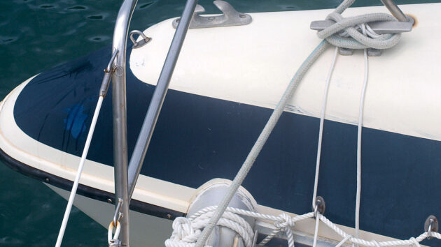 Lines wrapped around cleats on a boat