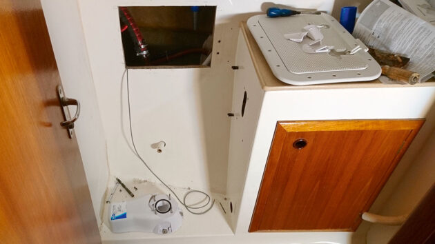 A hatch being bulid on a boat for pipework for a waste holding tank