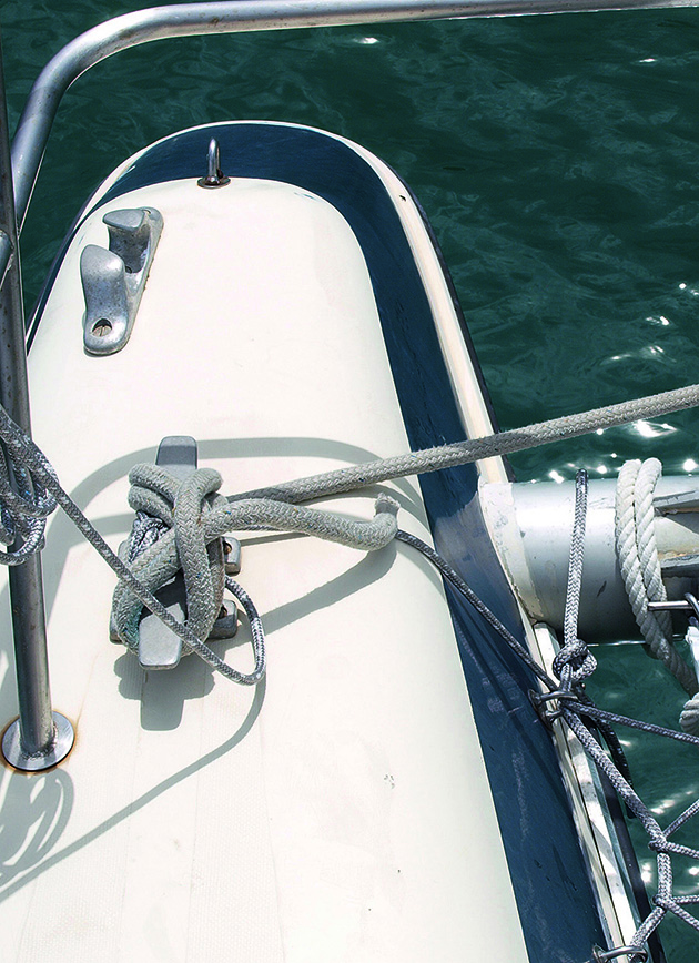 Rope tied off to a cleat on a catamaran