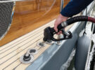 A man using a marine diesel pump to fill up his boat
