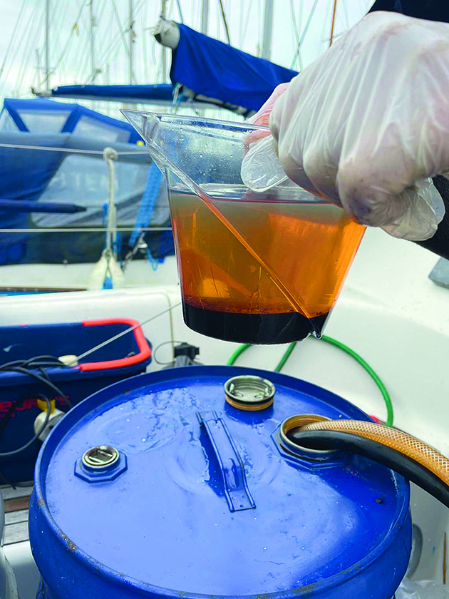 A man cleaning fuel for an engine