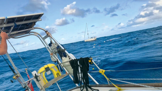 fuel in jerry cans being transfered between two yachts at sea