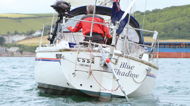 A yacht with a windvane steering system aft