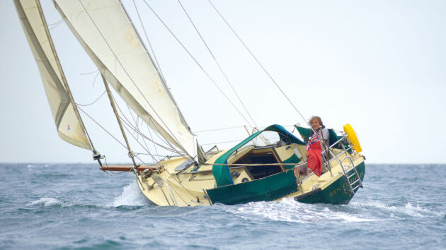 A boat heeling to one side displaying weather helm