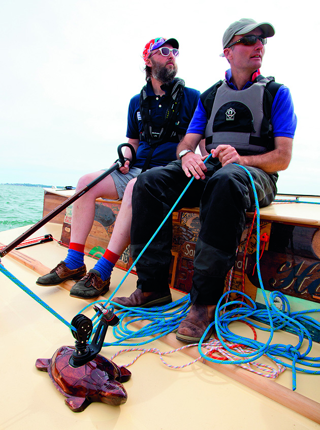Two men sailing the yacht, Collective Spirit