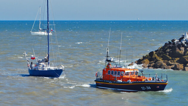 RNLI lifeboat towing a yacht. Credit: RNLI