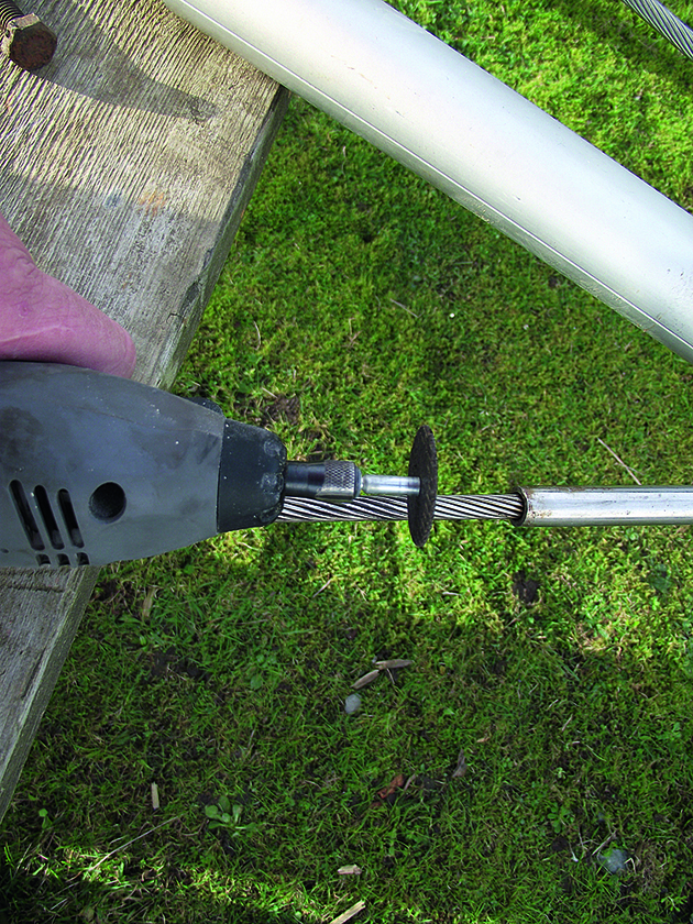 A man using a Dremel tool