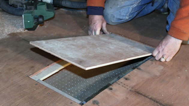 A new patch of wood being fitted to a boat