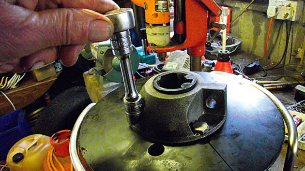 A furler drum being reassembled in a workshop