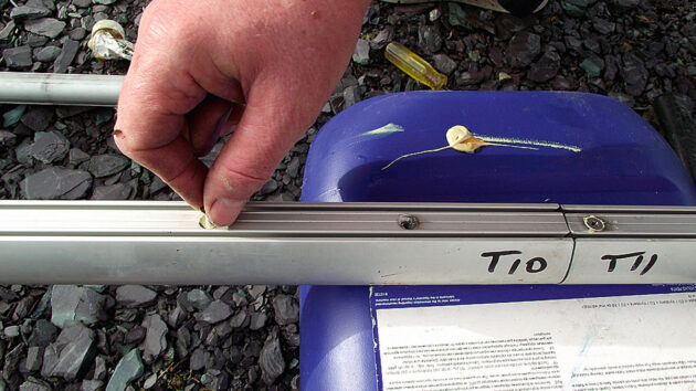 Screws beung used to secure foil sections in a boat furler