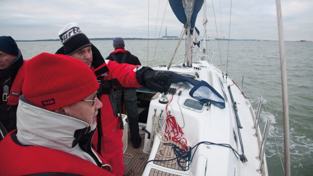 A boat crew practising man overboard turns