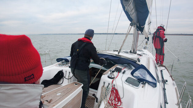 A boat crew practicing man overboard recovery