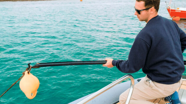 A man using a boat hook