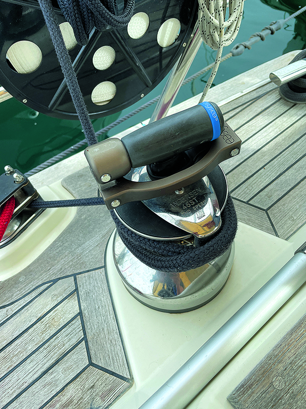 A goldable winch handle on a boat, used as part of boat improvements