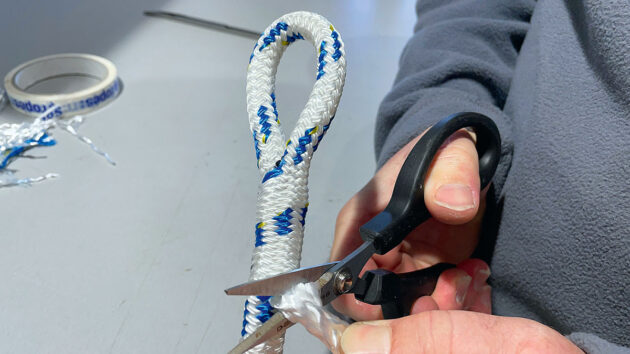 A person carrying out boat improvement by making an eye splice