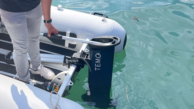 A man using an electric outboard as part of boat improvements