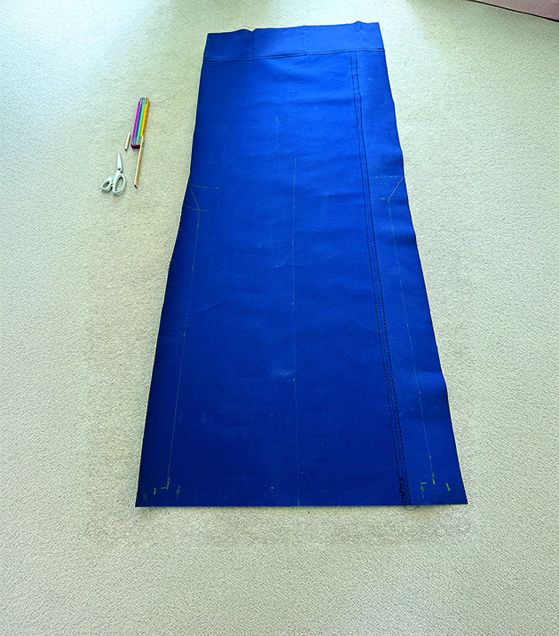 A person making a companionway cover for a boat