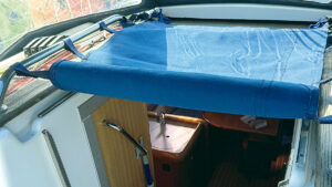 A folded back companionway cover on a boat