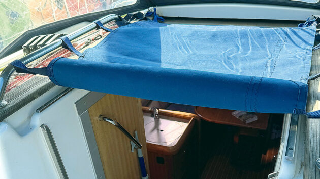A folded back companionway cover on a boat