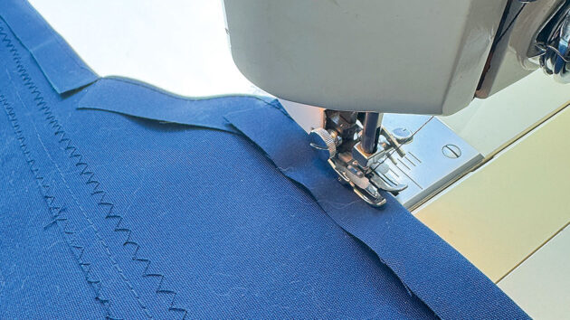 Canvas being sewed on a machine