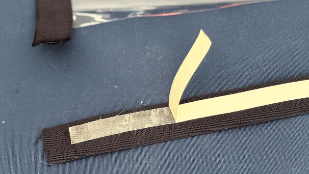 Binding being prepared for companionway cover