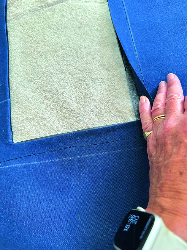 A window being cut into a companionway cover